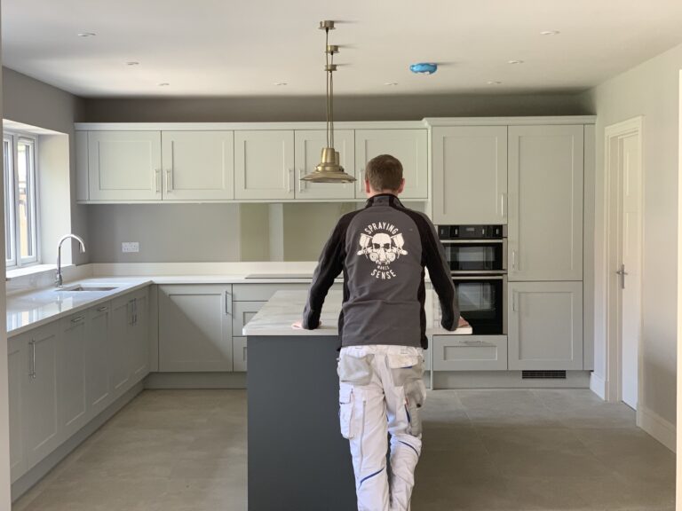 spraying kitchen cabinets